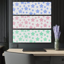 Printify sustainable triptych prints featuring blue, pink, and green star patterns displayed above a workspace with laptop