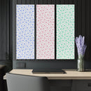 Printify sustainable triptych prints with pastel star patterns in blue pink and green above modern desk