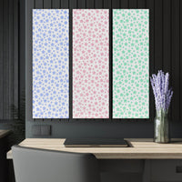 Printify sustainable triptych prints with pastel star patterns in blue pink and green above modern desk
