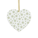Heart-shaped seasonal decoration with gray twinkling stars holiday decoration pattern hanging by gold string