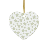 Heart-shaped seasonal decoration with gray twinkling stars holiday decoration pattern hanging by gold string