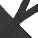 Close-up of black eco-friendly cotton tote bag strap showing durable stitching