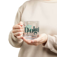 Clear glass eco-friendly dog dad mug with paw print held by person in beige sweatshirt