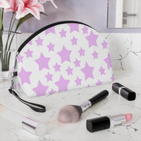 Printify eco-friendly makeup bag with pink star pattern beside makeup brushes and lipstick on marble counter
