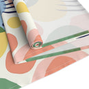 Printify eco-friendly table runner with colorful abstract shapes and green trim for sustainable dining