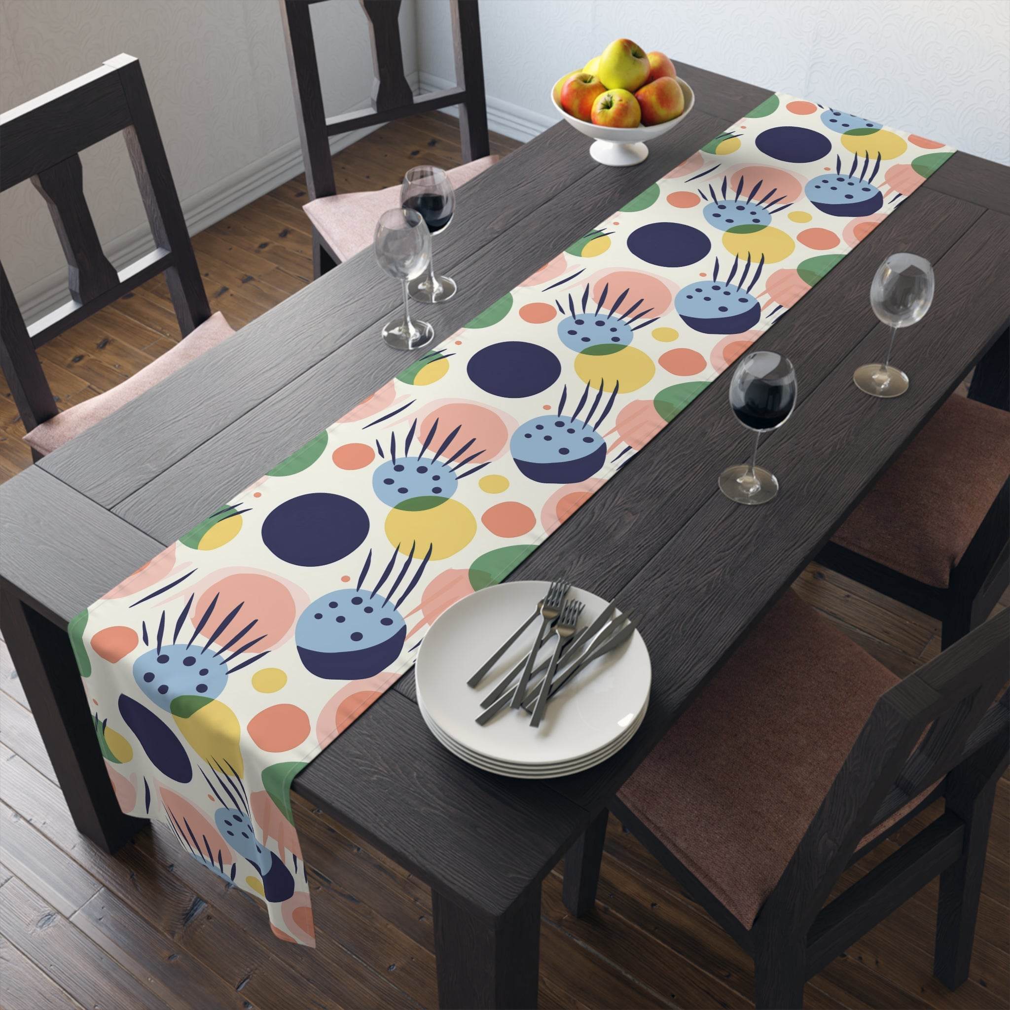 Printify eco-friendly table runner with colorful abstract design on dark wood dining table