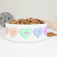 White pet bowl with colorful hearts featuring XOXO design pet bowl filled with dog treats